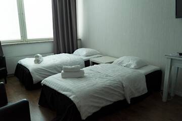 Фото номера Двухместный номер с 2 отдельными кроватями Апарт-отели Hotelli Alexanderin huoneistohotelli huoneet г. Мянття 9